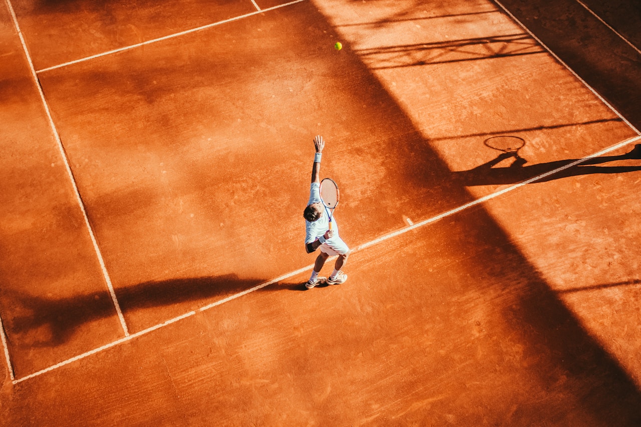 Tennis player mid-swing